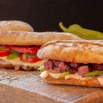 mixed-sandwich-types-with-various-foods-on-woggoden-board