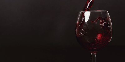 Alcoholic drink. Red wine pouring